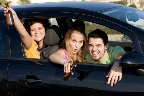 teenager taking a breathalyzer test