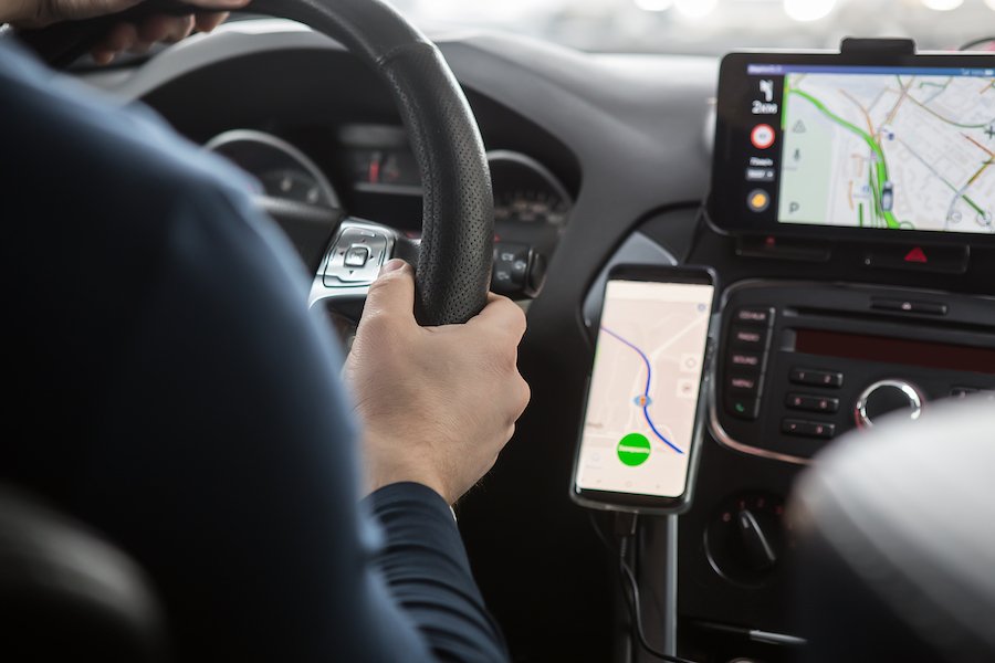 Dashboard of car showing phone navigation